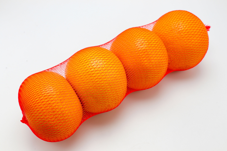 鮮やかなオレンジネットのみかん包装